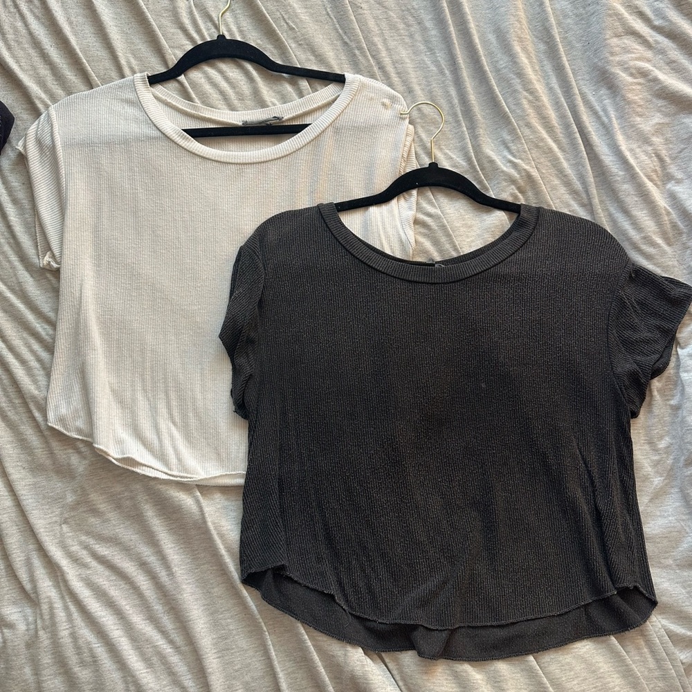 Both Garage ribbed T-shirts with rounded bottoms. Size Small